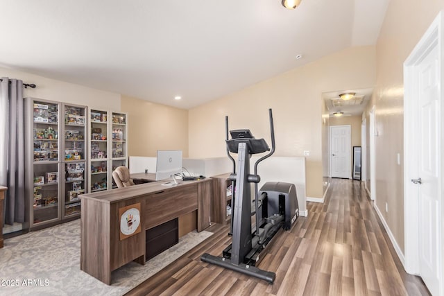 exercise room with hardwood / wood-style floors