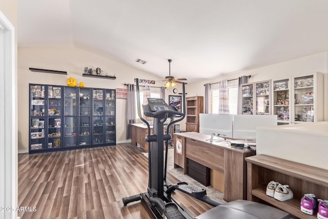 workout room with hardwood / wood-style flooring, vaulted ceiling, and ceiling fan