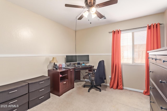 carpeted office with ceiling fan