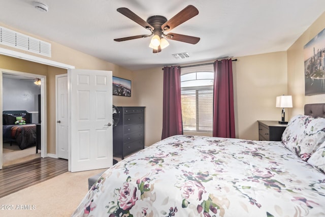 carpeted bedroom featuring ceiling fan