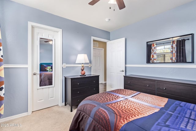 bedroom featuring light carpet and ceiling fan