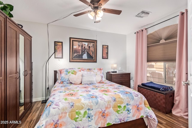 bedroom featuring dark wood-type flooring and ceiling fan