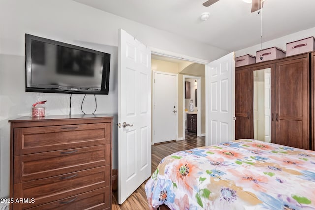 bedroom with ceiling fan and hardwood / wood-style floors