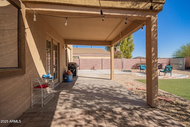 view of patio featuring a grill