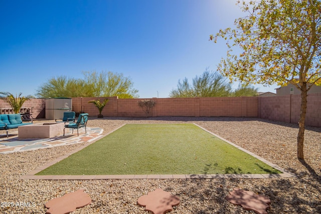 view of yard featuring a patio area and an outdoor fire pit