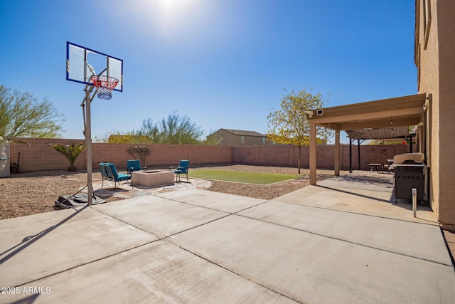 view of patio / terrace featuring a grill and a fire pit