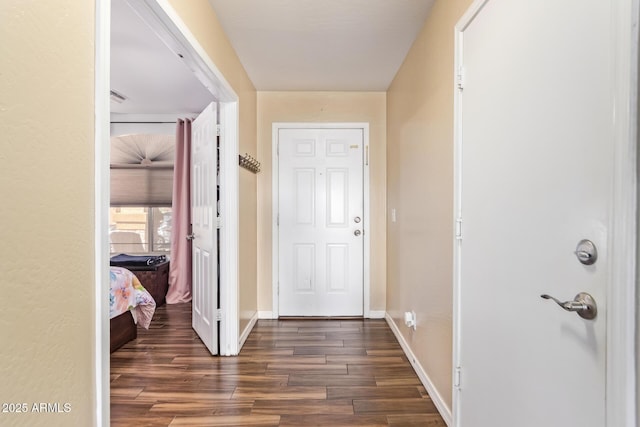 hall with dark wood-type flooring