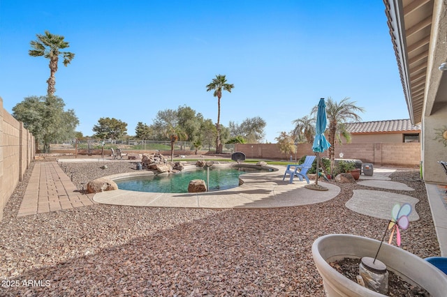 view of pool featuring pool water feature and a patio