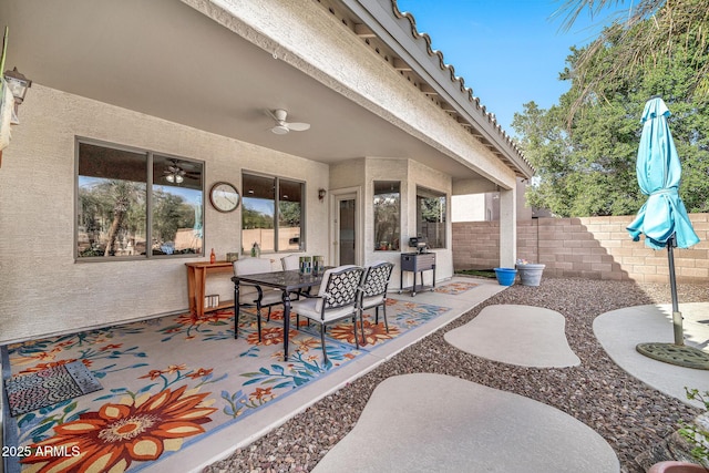 view of patio featuring ceiling fan