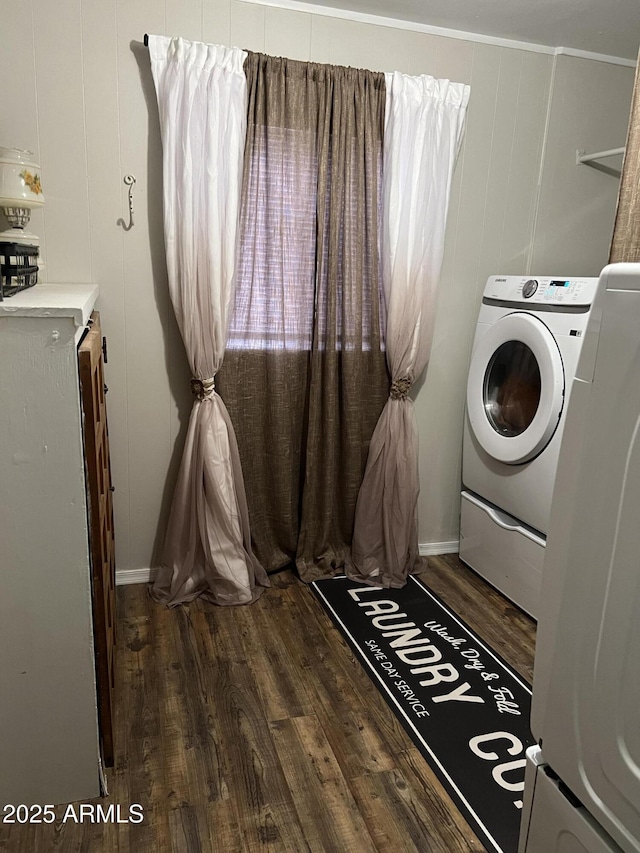 laundry area with washer / dryer and wood finished floors