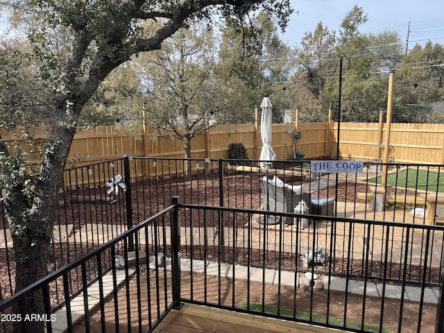 view of gate with fence