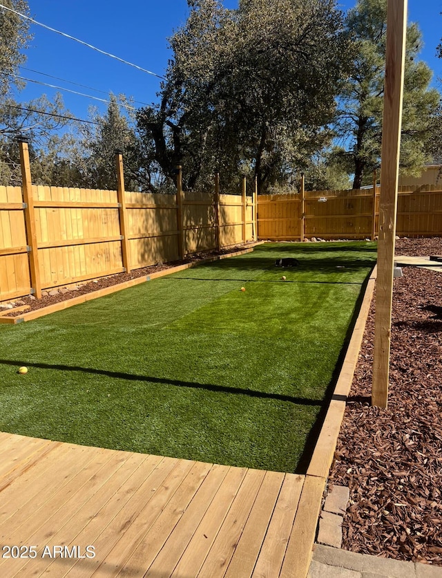 view of yard with a fenced backyard