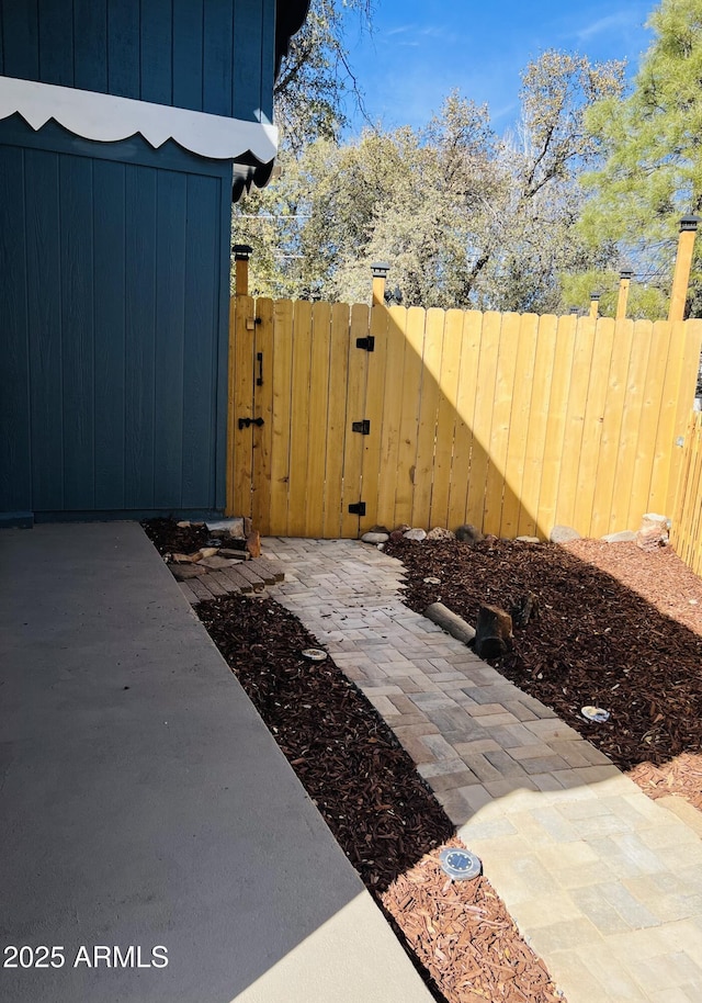 view of patio / terrace featuring a gate and fence