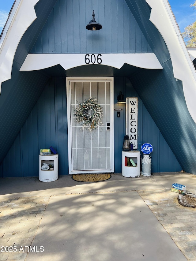 doorway to property with board and batten siding