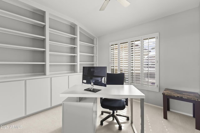 carpeted office with ceiling fan and lofted ceiling