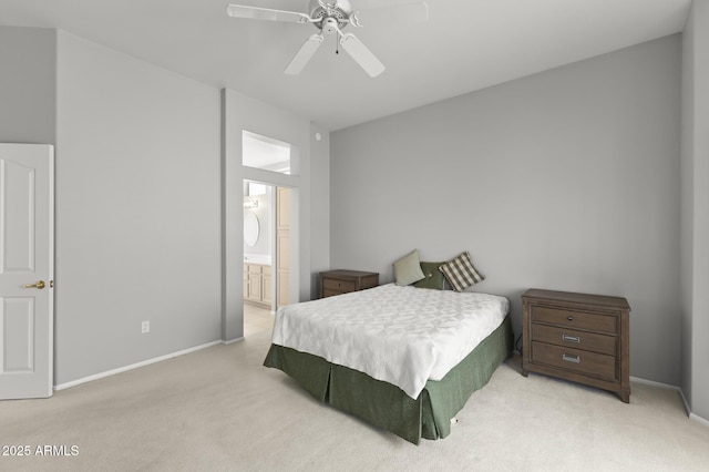 carpeted bedroom featuring ensuite bathroom and ceiling fan