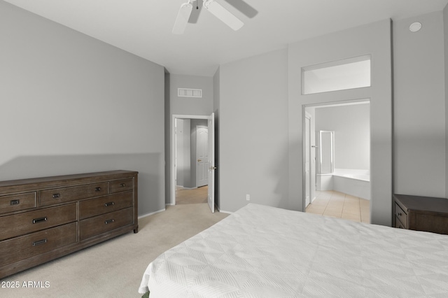 carpeted bedroom with connected bathroom and ceiling fan