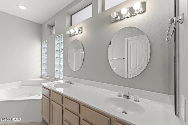 bathroom with vanity and a bathtub