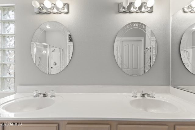 bathroom with vanity and an enclosed shower