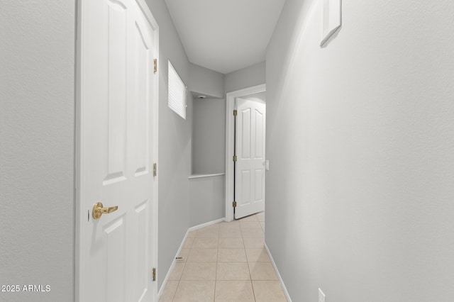 hallway with light tile patterned floors