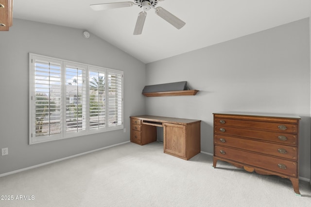 carpeted office space with lofted ceiling and ceiling fan