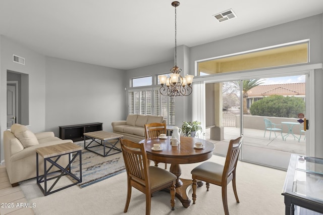 dining area with a notable chandelier