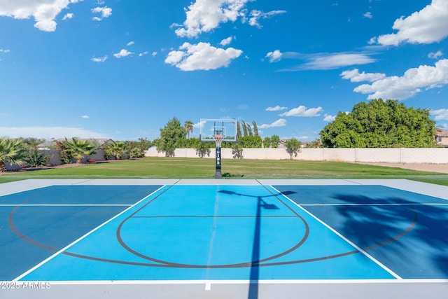 view of basketball court featuring a yard