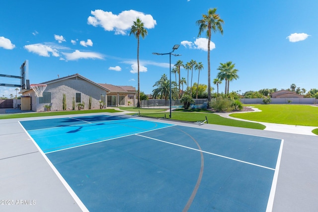 view of basketball court with a yard and tennis court