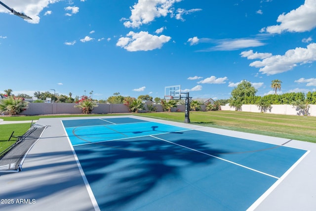 view of basketball court featuring a yard