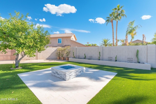 view of yard with a patio area and an outdoor fire pit