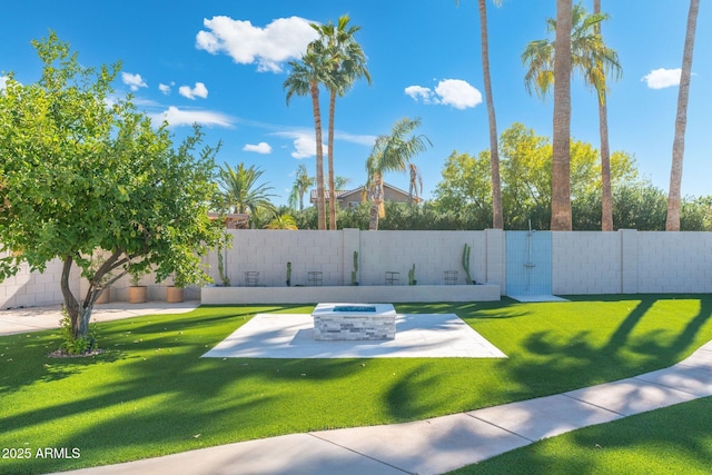 view of property's community featuring a patio and a lawn