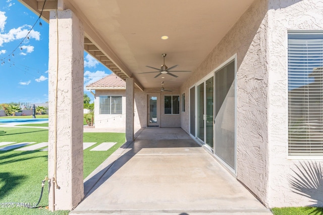 view of patio featuring ceiling fan