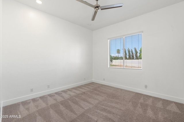 unfurnished room featuring carpet and ceiling fan