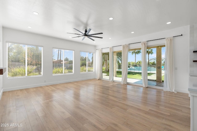 interior space with ceiling fan