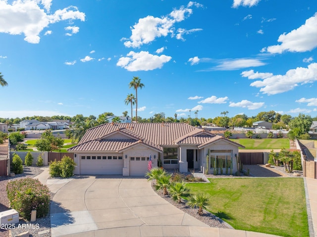 view of front of property featuring a garage and a front yard