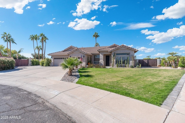 view of front of property with a garage and a front lawn