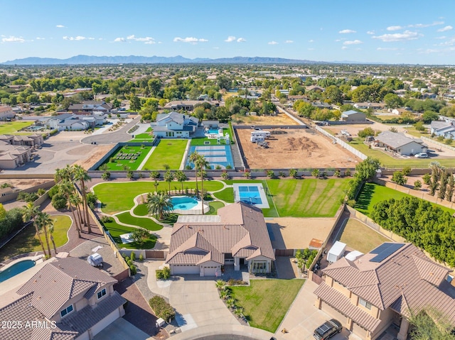 birds eye view of property with a mountain view