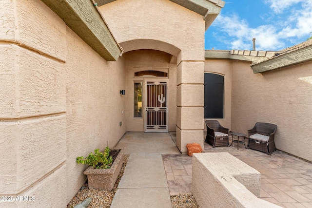 property entrance with a patio