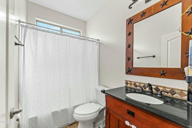 full bathroom featuring toilet, shower / bathtub combination with curtain, and vanity