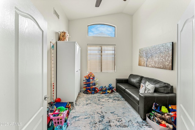 recreation room featuring ceiling fan and vaulted ceiling