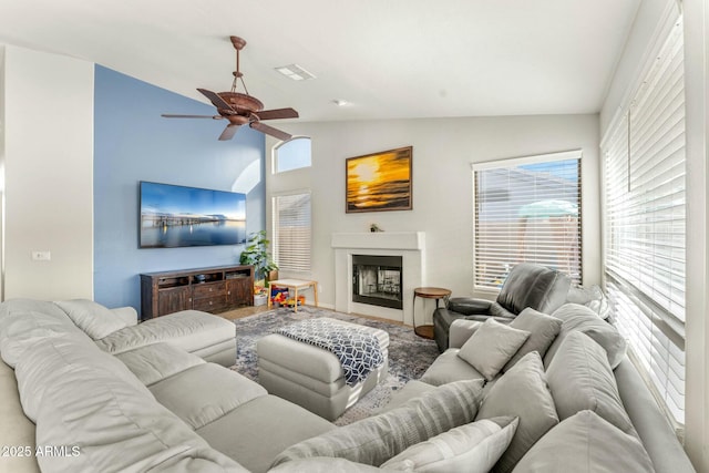 living room with vaulted ceiling and ceiling fan