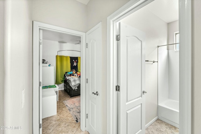 hallway with light tile patterned floors