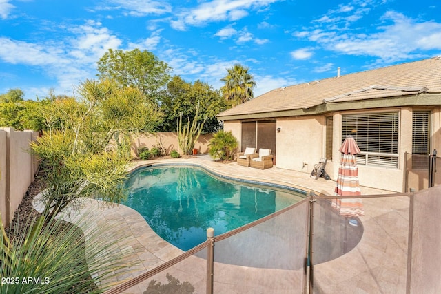 view of swimming pool with a patio area