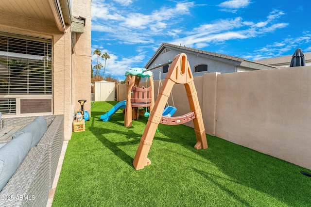 view of jungle gym featuring a yard