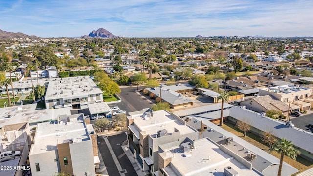 birds eye view of property with a mountain view