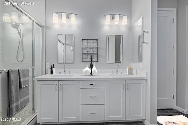 bathroom featuring vanity and a shower with door