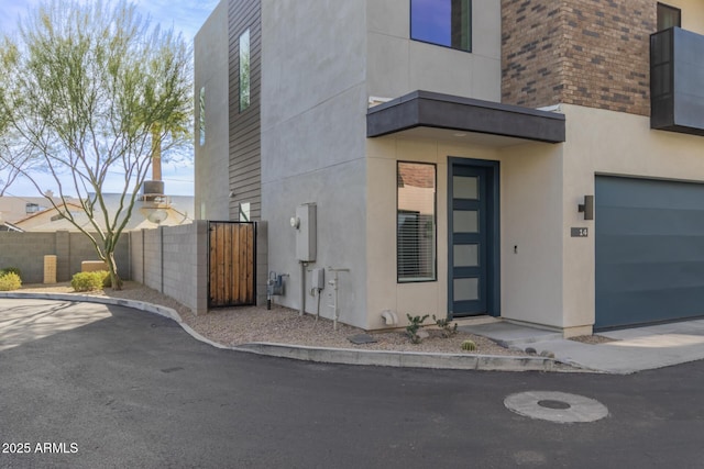 view of exterior entry featuring a garage