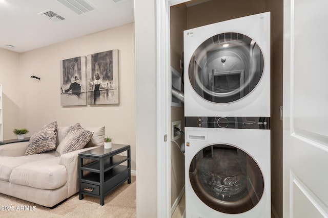 2631 S Sulley Dr Unit 104, Gilbert, AZ 85295 - washroom featuring stacked washing machine and dryer and carpet