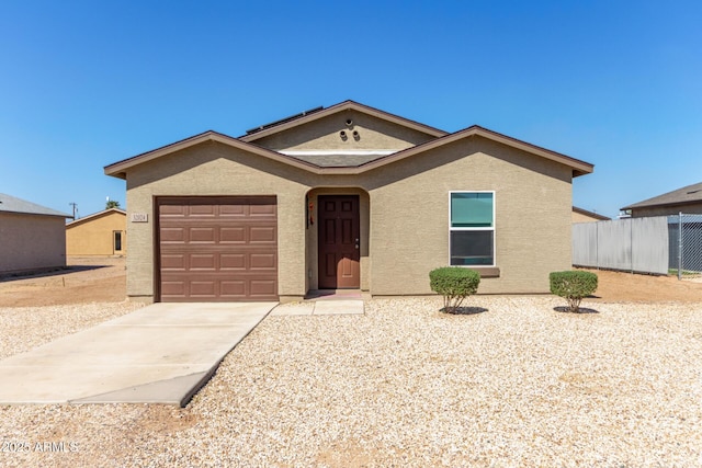 32024 N Redding St, Wittmann, AZ 85361 - single story home featuring an attached garage, concrete driveway, stucco siding, and fence