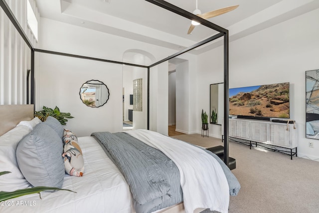 bedroom with light colored carpet and ceiling fan